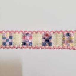 New Cross-stitched Ribband quilt themed ivory with pink trim.