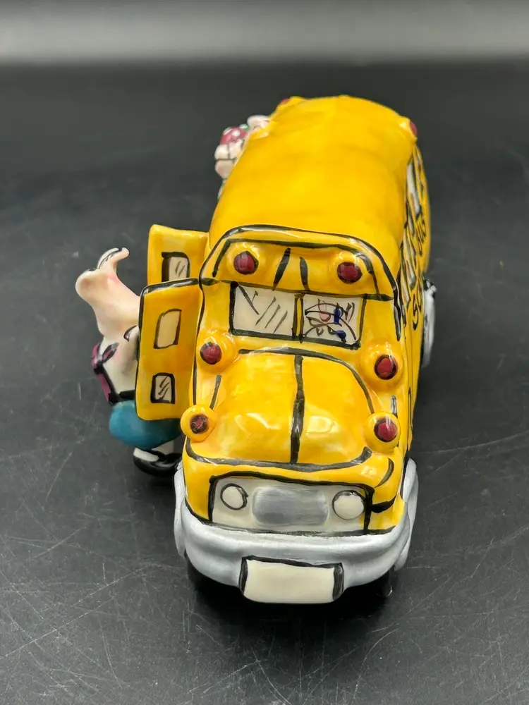 2002 Heather Goldmic yellow school bus with pigs, ceramic figurine, blue sky clay Works
