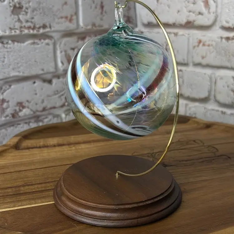 hand-blown glass witch ball, also known as a friendship ball with Swirls