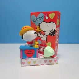 vintage Snoopy figure kissing booth on crafted Valentine base