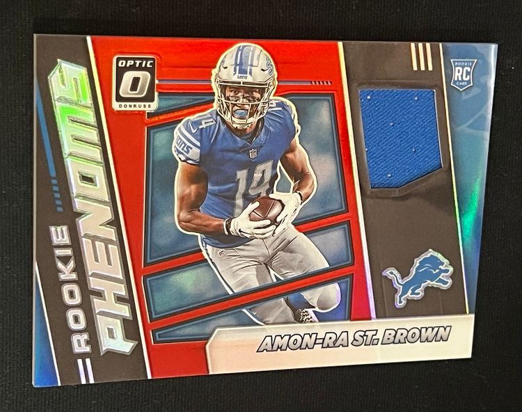 Amon-Ra St.Brown 2021 Donruss Optic Rookie Phenoms Holo Red Prizm RC #RPH-28 Detroit Lions