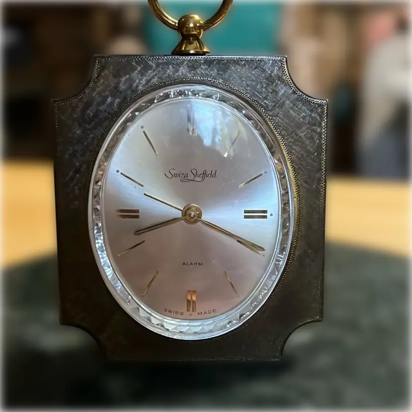 Vintage Brass Swiza Sheffield mechanical alarm clock with a ring handle. Switzerland Beautiful Crystal Face, Very Heavy For Size