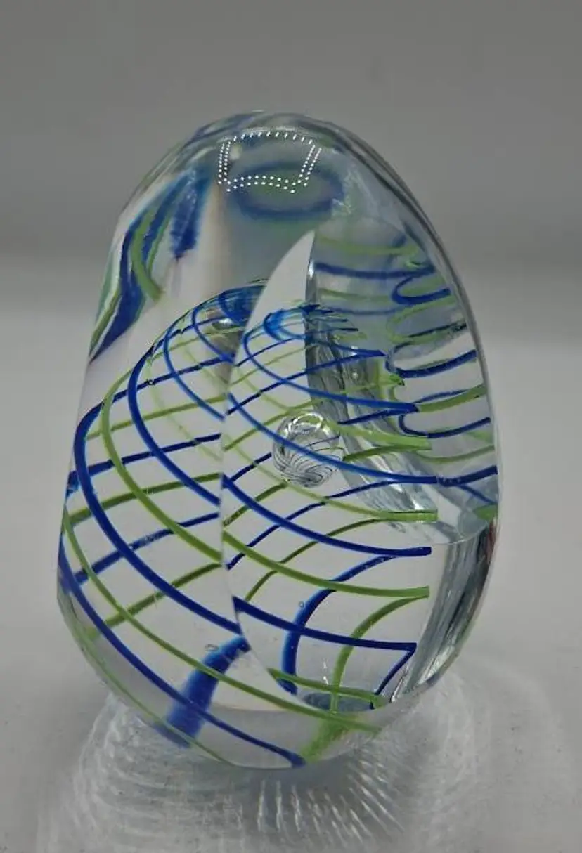Blue/Yellow Swirl, Controlled Bubble, Thrice Hand-Cut Egg Shape Glass Paperweight