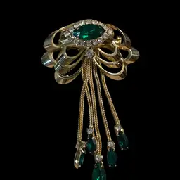 Art Deco Emerald And Rhinestone Dangles In Goldtone Finish With Top Stacked Bows And A Large Marquis Stone With Surrounding Stones