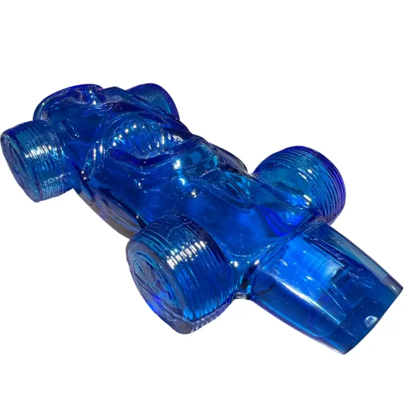 Vintage Avon blue glass molded race car cologne bottle.(empty)