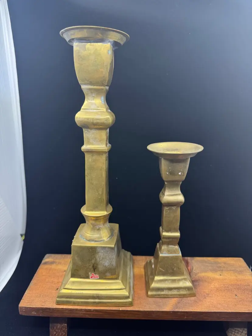 A pair of vintage solid brass candlesticks with square bases, 10” & 6”