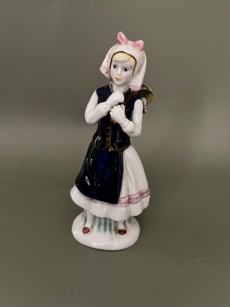 Charming Porcelain Figurine with Pink and Blue Accents