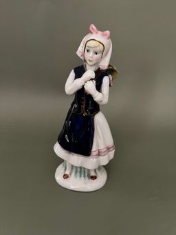 Charming Porcelain Figurine with Pink and Blue Accents
