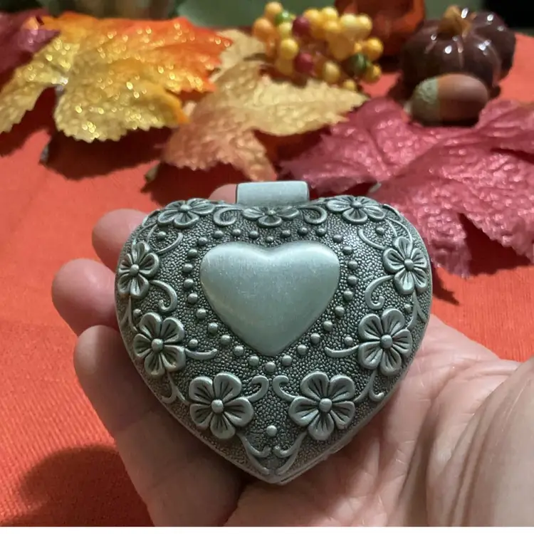 Beautiful Silvertone Trinket Heart Box. Blk Velvet Like Lined Material. Floral Flower Design And Heart Outline In Center Of Lid. Great For Rings . Earrings . Little Trinkets, Coins Etc.