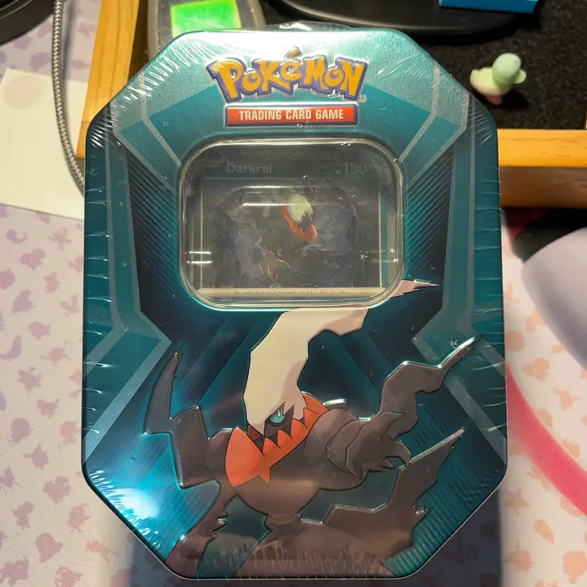 Pokémon TCG Triple Whammy Collector Tin featuring the legendary Pokémon Darkrai.