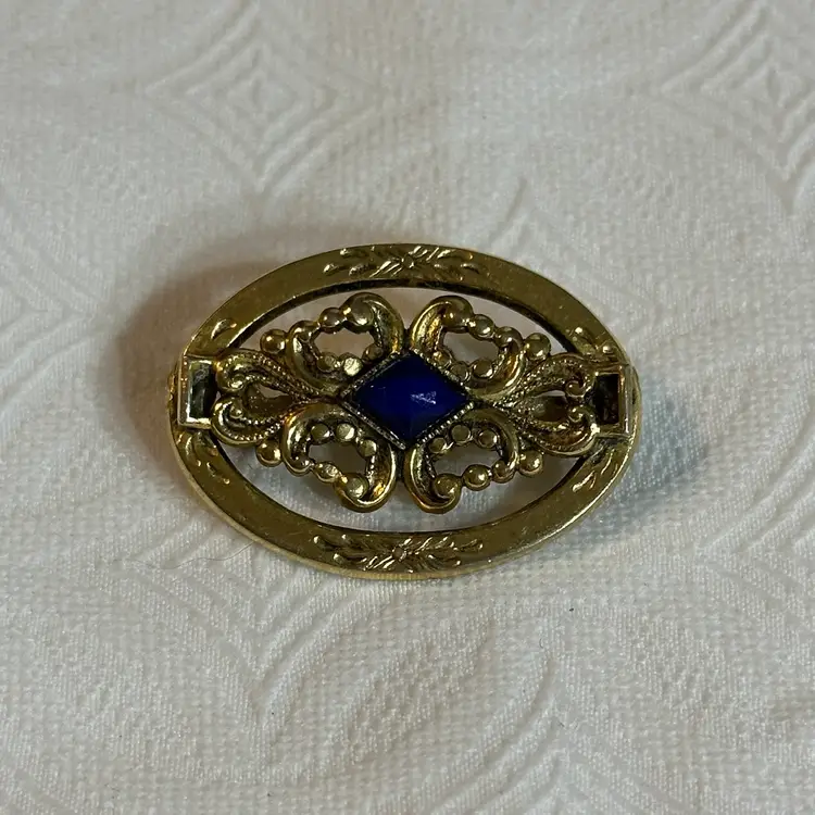 Vintage Gold Tone Victorian Like Oval Sash Brooch With Dark Blue Glass Center