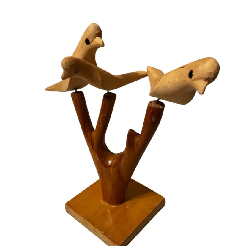 A handcrafted wooden bird sculpture