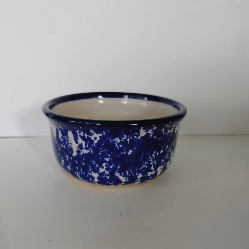 Blue sponge paint apple bowl. No chips or cracks. 2.25 high and 4.25 diameter. Signed on bottom.