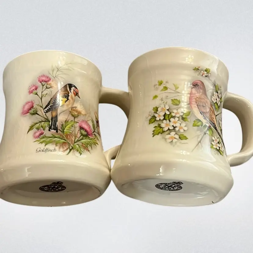A pair of vintage Prinknash Abbey Pottery mugs with painted bird designs And Gold Rim. 2.5”