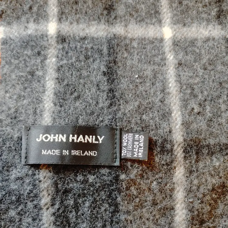 Scarf: Brand- John Hanly. Made in Ireland. Material- 70% wool, 30% cashmere. Black & grey plaid. No callouts.