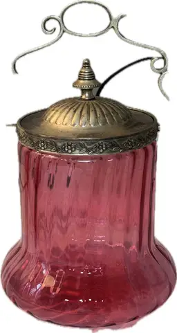 Cranberry glass biscuit jar with ornate metal lid and hanger- Possibly Victorian Era