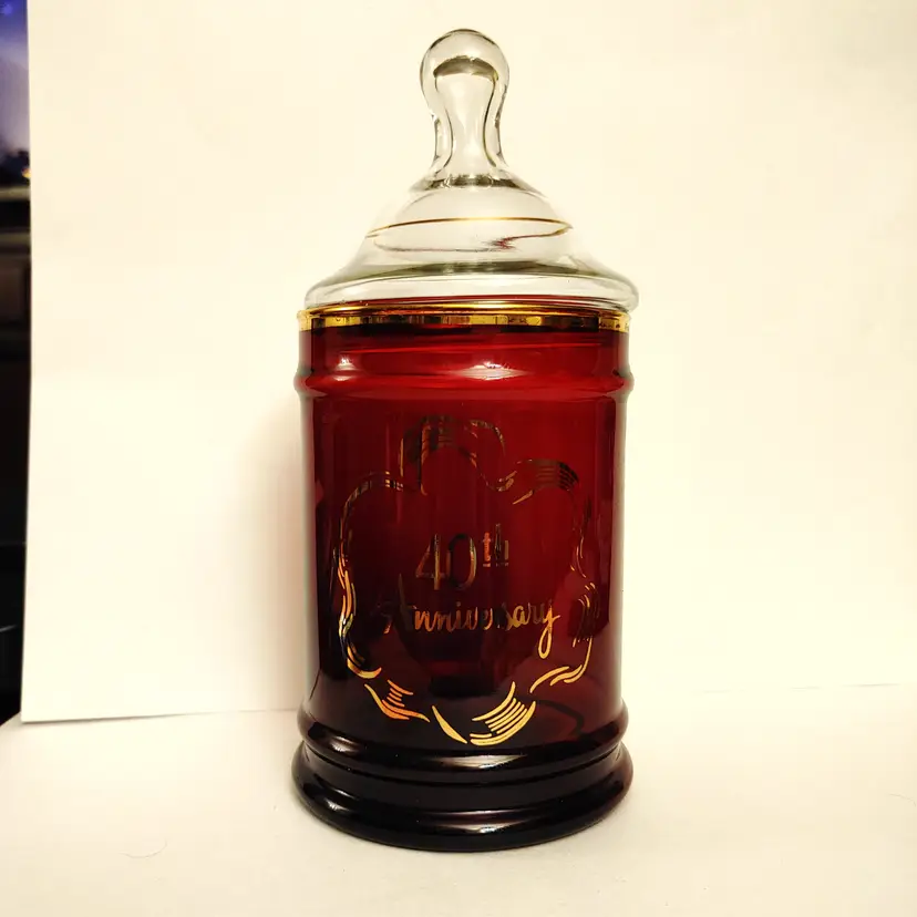 40th Anniversary cranberry colored Apothecary jar with lid. 8.75 inches high. No chips.