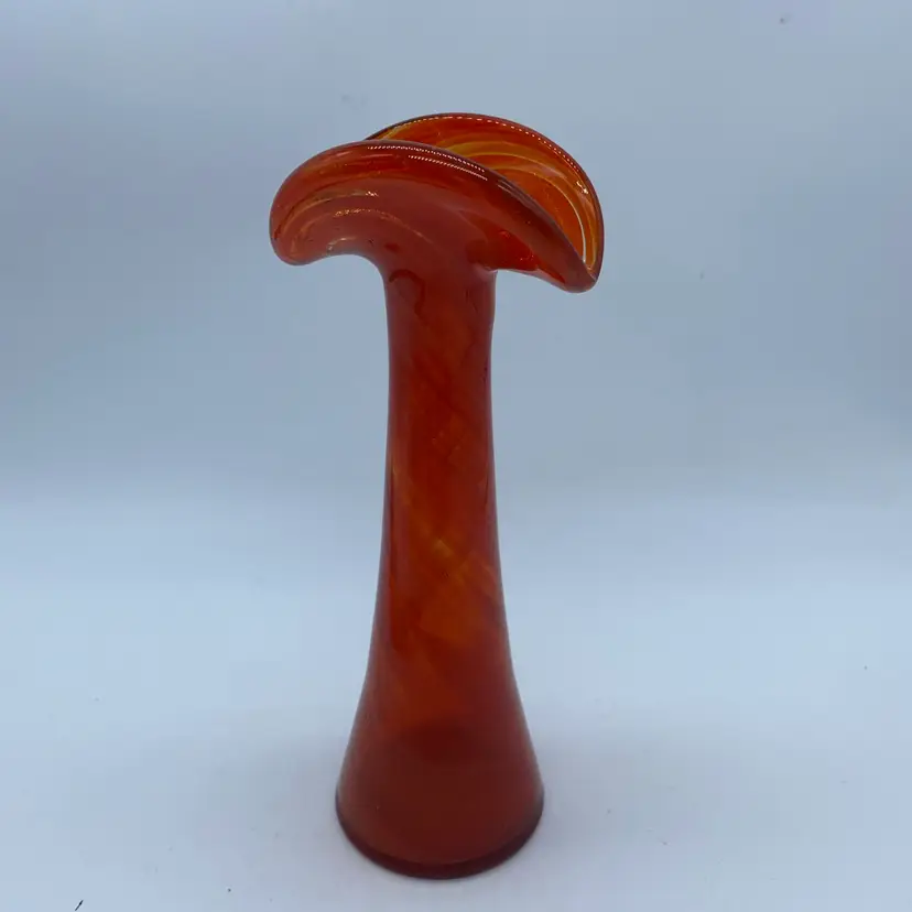 #0706 Hand-blown orange swirled art glass vase with a fan-shaped ruffled top.