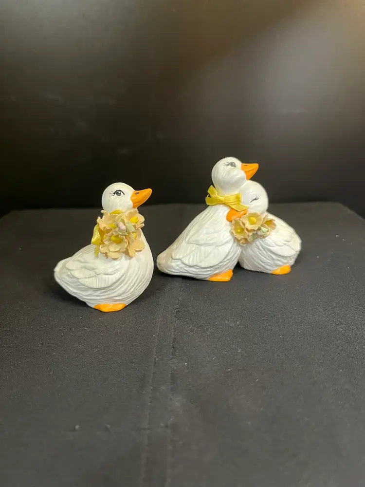 Vintage Hobbiest "Smalls" Ceramic Geese. One is a Cute Couple-Complete w/ Bow Around One Neck, & Dried Flowers Around the Other. The Other Figurine is a Goose by Itself w/ Yellow Ribbon & Dried Flowers-Lot 60