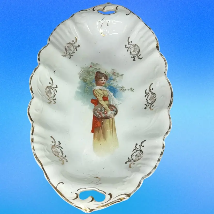 This is an antique Hand painted Oblong 12”, Limoges porcelain tray.