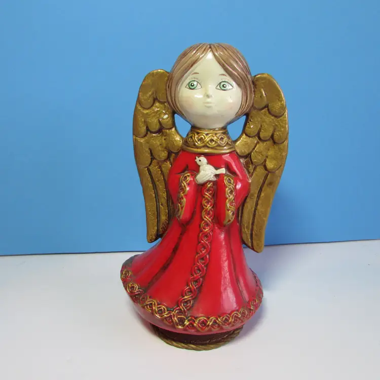 vintage composite angel holding a bird musical figure Christmas decor 9"
