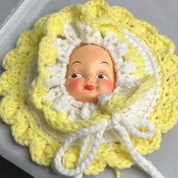 Crocheted Doll Face Flower