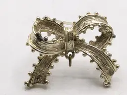 Vintage Tancer II Silver Tone Bow Brooch with Textured Detail READ