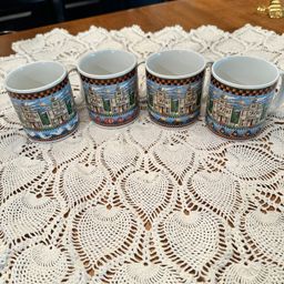 Set of 4 Debbie Mumm Haunted House Halloween mugs.