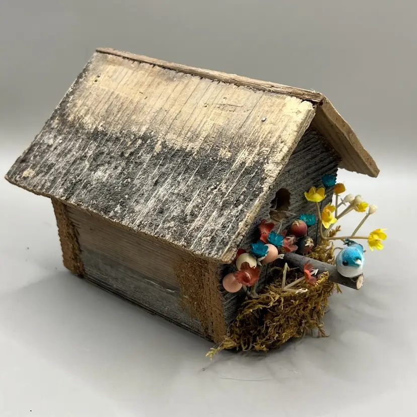 Handmade Wooden Birdhouse With Flowers And A Blue Bird