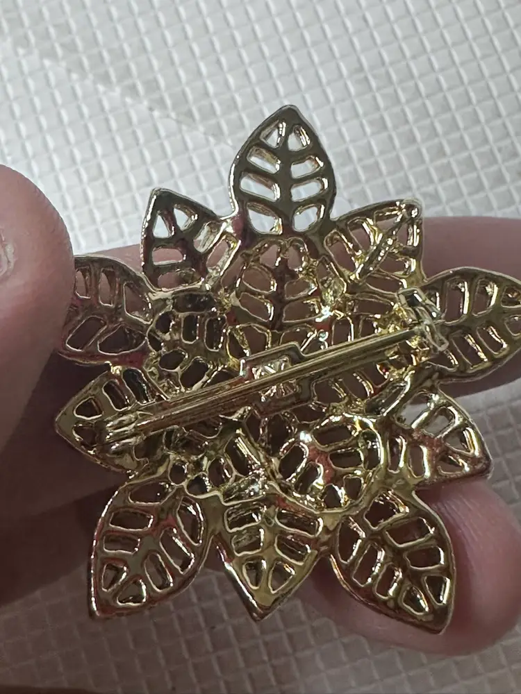 Blue Rhinestones In A Flower Brooch