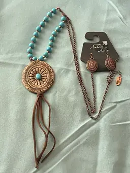 Amber’s Allie Necklace & Earrings Set Brown Cord Leather Pendant Turquoise Beads
Brand new with tags
Necklace is 28” long. Pendant is 2” H x 1.75” W
