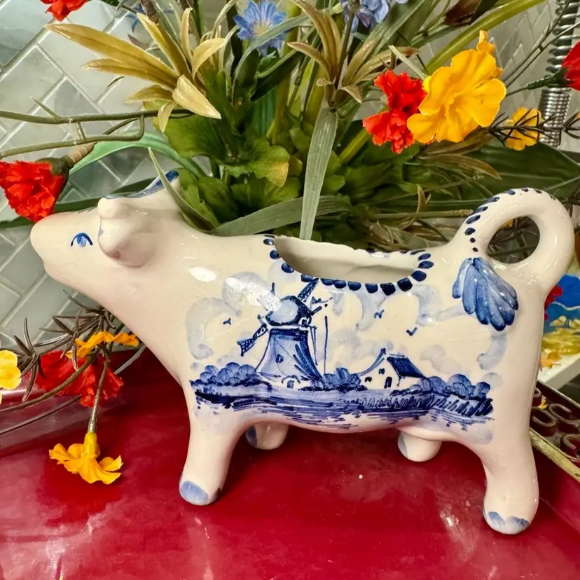 Vintage Holland Delft blue cow creamer, ceramic milk jug hand-painted w/a windmill scene 7” w & 4” t