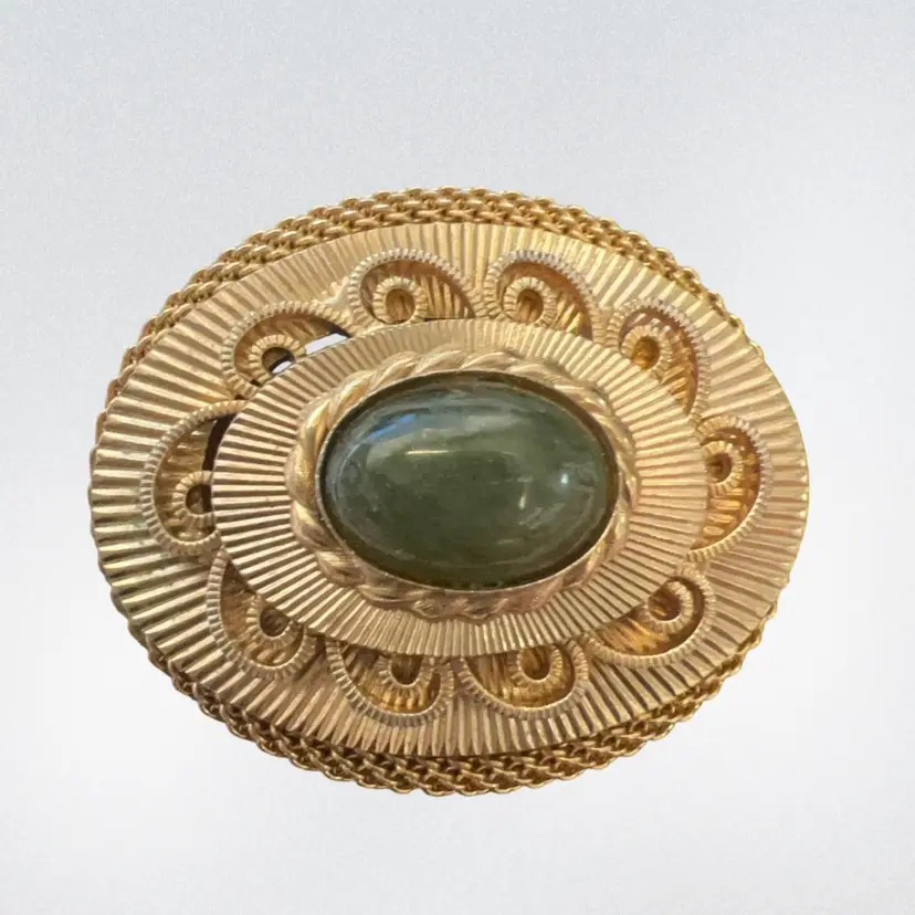 Vintage Hobe gold-tone brooch with green cabochon and ornate filigree. Signed Pin Or Pendant
