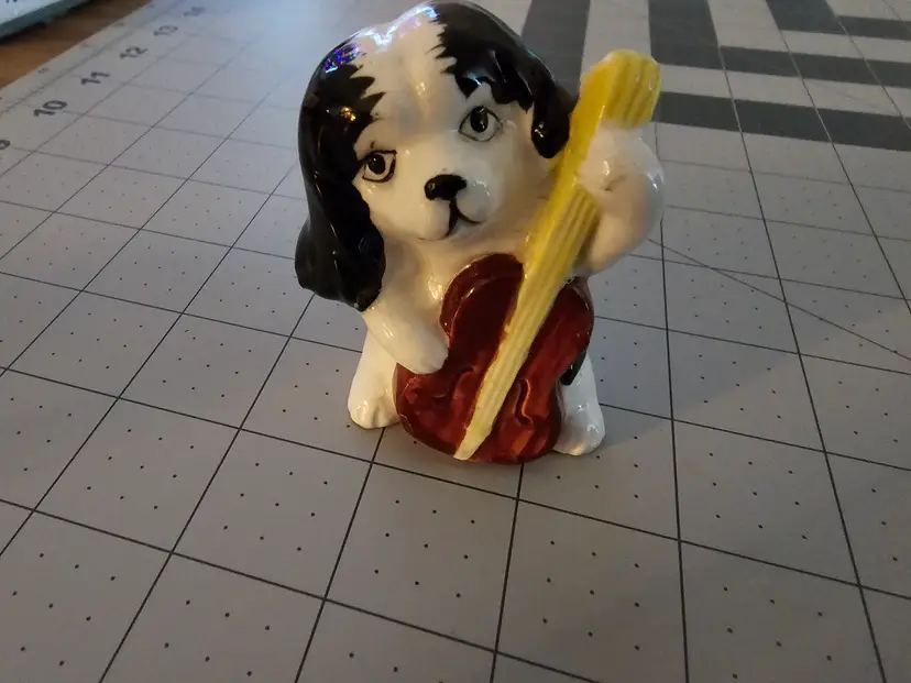 Ceramic spaniel playing cello Japan