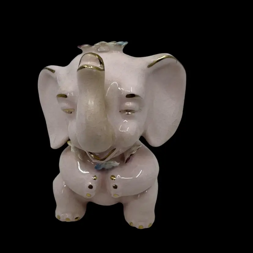 Vintage Norcrest pink ceramic elephant figurine with gold accents.