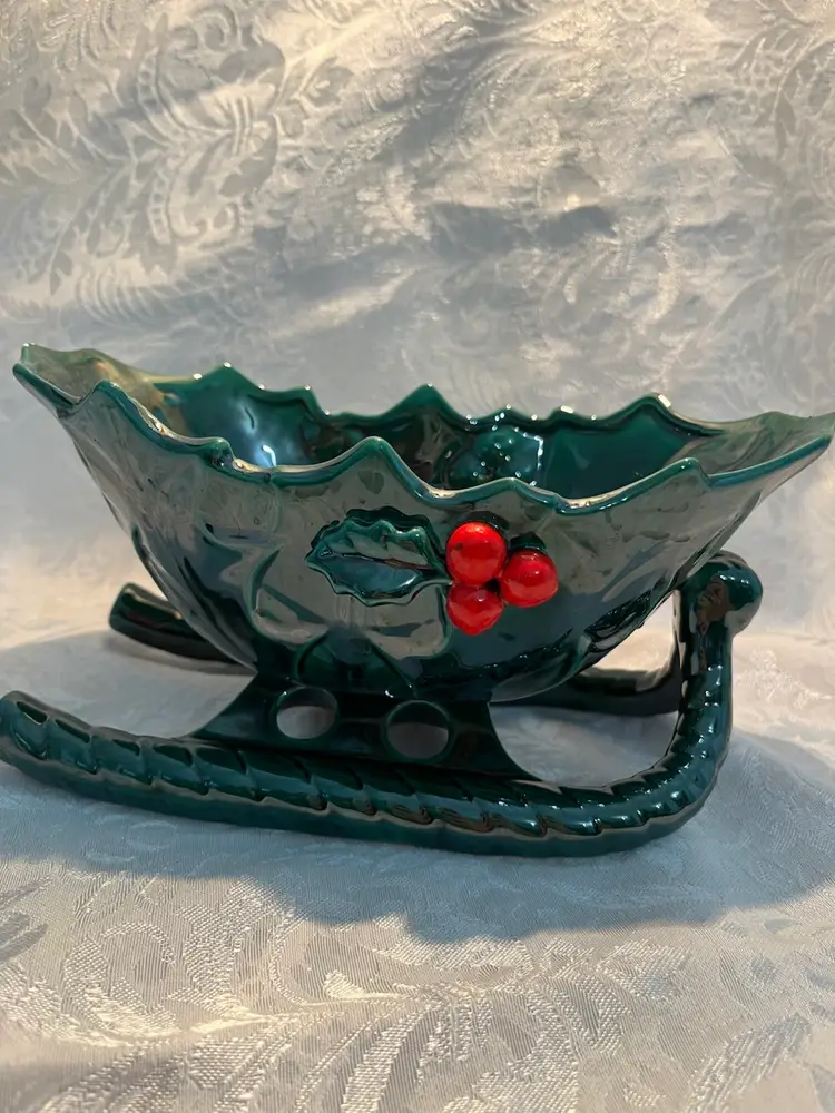 Vintage Lefton ceramic sleigh bowl with holly and berry decorations.