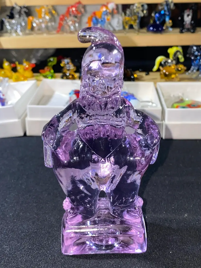 #02- Mosser Glass Co. This is part of the Series -  SO GLAD I FOUND YOU AT THE END OF THE RAINBOW - MINDY.  The Jester Style Clown is 4.75" Tall. He is a clear Lavender color. 1983