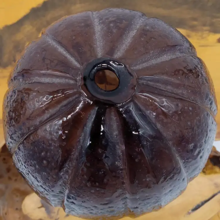 Purple blown glass vase, orange texture, round