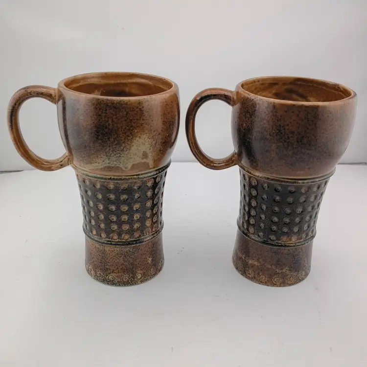 Pair of Holt Howard stoneware face mugs