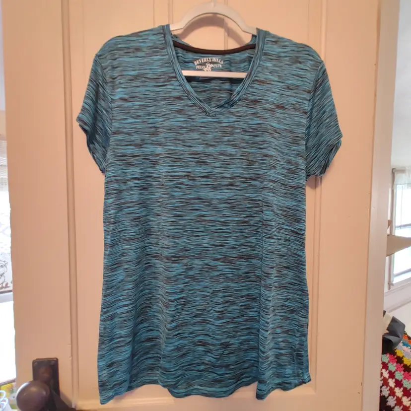 Top- Brand: Beverly Hills Polo Club. Size XL. Teal and black top. Material- 90% polyester, 10% spandex. No callouts.