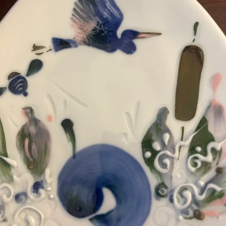 Vintage Porcelain dish with Asian-inspired motifs of fish and birds. Signed By Michael Crumb 1997.
8”