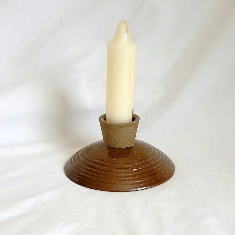Brown Pottery Candle Holder With Candles