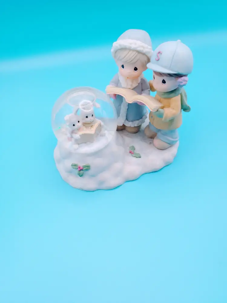 Precious Moments " Christmas Caroling Bunnies," 1999.