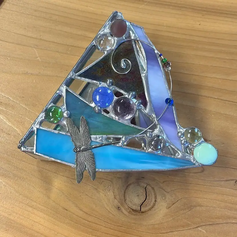 Triangle Stained And Leaded Glass Box With Hinged Lid. Top Has A Dragonfly And Glass Pebbles Added. Each Side Is A Little More Than 5” Wide And 2 1/2” Tall