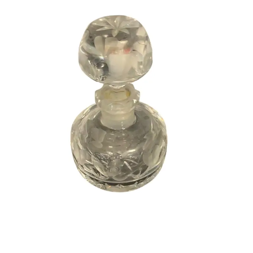 Crystal Perfume Bottle With Hearts Etched On It. Measures 5”x2.75”.