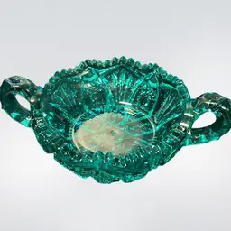 This is a turquoise pressed glass two-handled Nappy dish With Sawtooth Edge by L.E. Smith. 1910-1930