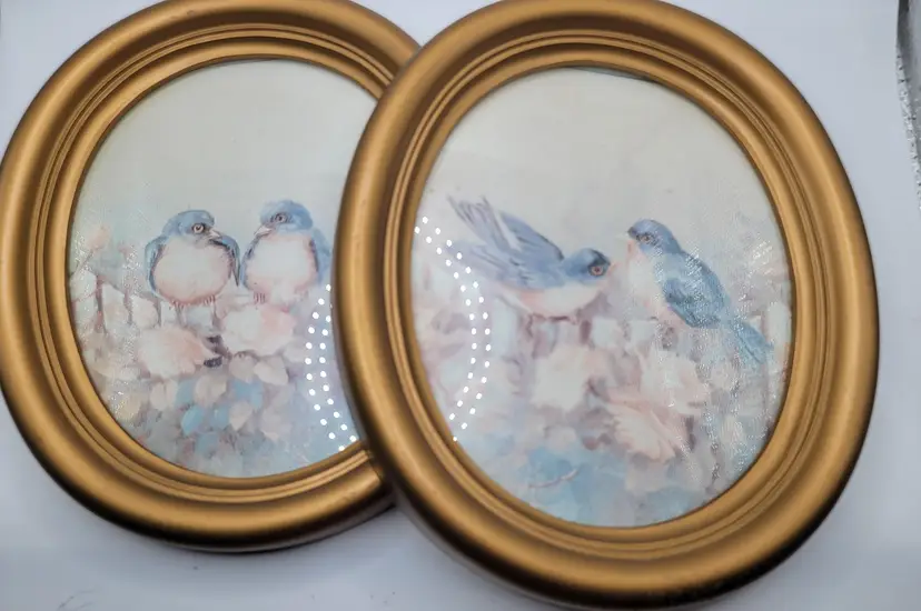 Pair of Vintage Bird paintings in blue. Made in the USA .  Approximately 6" oval.