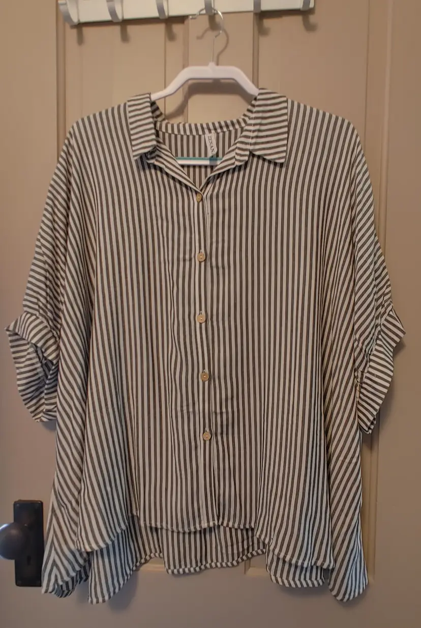 Top- Brand: Zenana. Size L/XL. NWOT. Oversized black white striped top. Material- 100% rayon. No callouts.