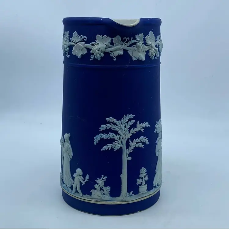 #1305 Vintage Wedgwood dark blue Jasperware pitcher with white relief Flaw 7.5”
