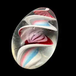27 - Glass Egg “marble” Cranberry And Pastel Rainbow ribbon swirl 1 3/8" Around And 2 1/16" Long. unmarked. As Is.